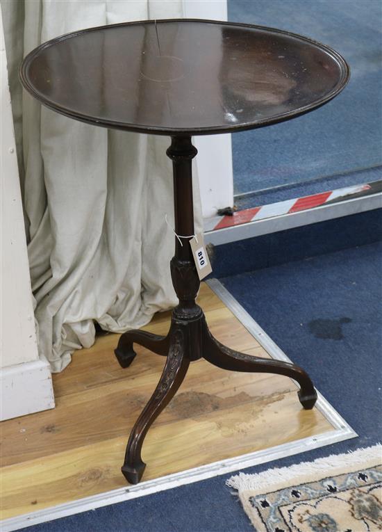 A George III style mahogany circular dish top tea table W.50cm